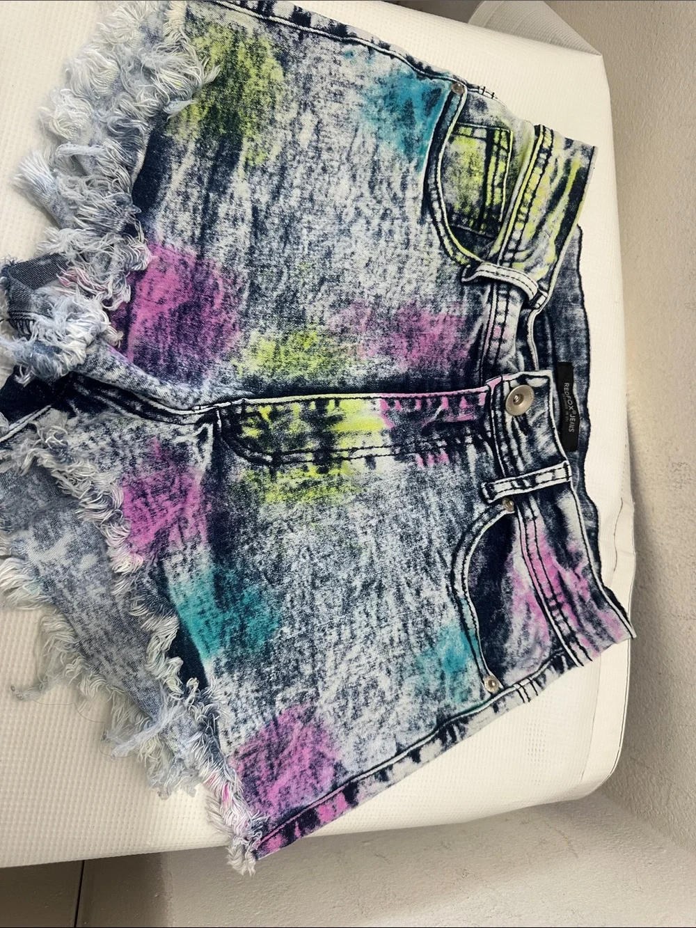 High-Rise Acid-Wash Denim Cutoff Shorts in Multicolor Splatter